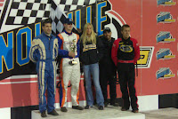 Dustin Selvage holding trophy in victory lane after winning Saturday's 360 A-Main at the Knoxville Raceway.  Also pictured are runner-up Gregg Bakker (blue suit) and 3rd place driver Lee Grosz