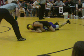 Knoxville's Jay Fresh controls his opponet during his 103 pound LHC championship match on Saturday.