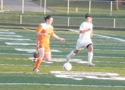 Pella's Kim Korver pursues the ball