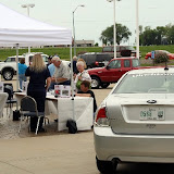 Guests browse the inventory and information at the 'Drive One' event