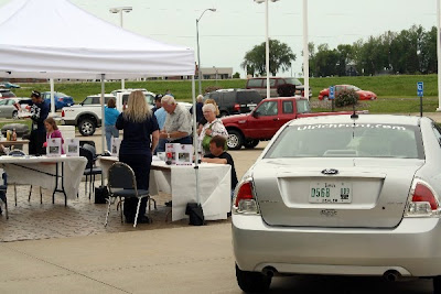 Guests browse the inventory and information at the 'Drive One' event