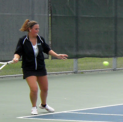 Pella's Nicole Oliver sets up for the return
