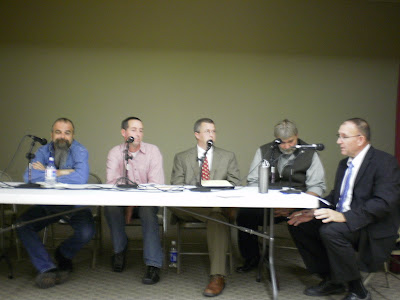 Pella City Council candidates (L to R) Daniel Spotten, David Vander Horst, Dan Vander Beek, and Bruce Schiebout, along with moderator Dr. Bob Leonard