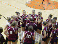 Eagles' Coach John Evenhouse talks things over with his team during a timeout