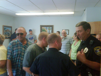 Residents gather at the Knoxville Police Department to honor retiree Sergeant Alvin Olivier