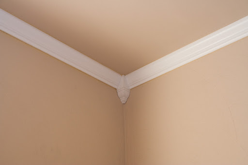We put blocks in the corner to make cutting the crown molding a lot easier. It gives it a nice Victorian style to it and makes for a nice accent.