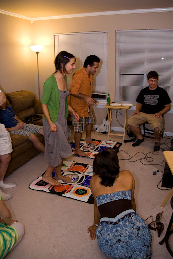 Kisa and Mohammed playing Dance Dance Revolution