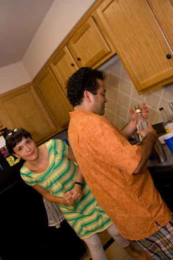 Annamari requesting a mixed drink from the bartender.