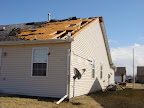 NOT my house. This is the neighbor's...Her roof was literally ripped right off!