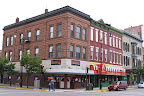 Gallina's Pizza near 5th and Monroe. The westernmost storefront was installed by Merle Norman Cosmetic as a retail shop.