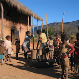 A village within the national park.
The rice grinding going on in the
background is tough work!
