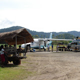 And a dirt runway to boot! 
Before boarding we waited around 
outside laying in hammocks 
(the waiting room under the trees).