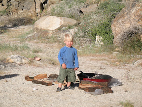 Joey looking for matches to start the campfire.