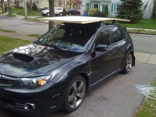 seats and with the OEM roof rack cross bars paired up with a Thule box