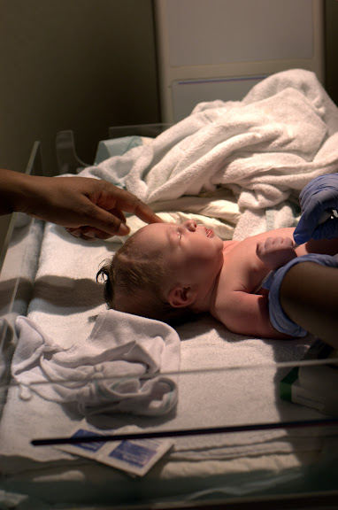 The nurses cleaning her up.