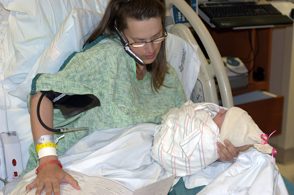 Already, she juggles the phone, the baby, a blood pressure cuff...