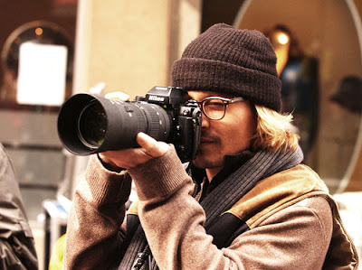 Actor Johnny Depp takes pictures of the photographers in between takes on the set of his latest fim "Secret Window" filming on location in New York City. Picture by Ronald Asadorian Ref: RANY 181003 A Splash News and Pictures New York      212-619-2666 Los Angeles   310-821-2666 London          207-107-2666 photodesk@splashnews.com