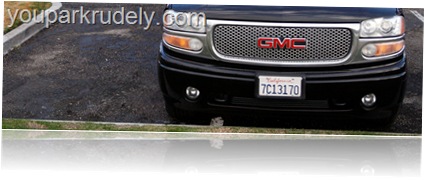 Black GMC truck parked rudely - youparkrudely.com