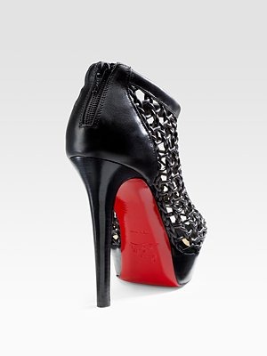 [CHRISTIAN-LOUBOUTIN---Coussin-Caged-.jpg]