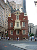 Old State House in background. Foreground street marker - site of the Boston Massacre March 5, 1770.