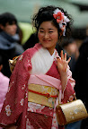 About to toss her ¥10 yen coin and make a prayer and/or wish