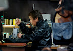 How many people you know work a sewing machine in a leather jacket?