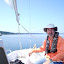 A happy sailor in an orange shirt