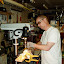 Pipes are cut to size on the table saw, then I drill eight holes in each flute body using a homemade jig