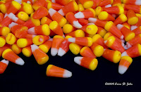 Brightly Coloured candy corn accidentally spilled on a black piece of posterboard that looked better on the posterboard than in the candy dish the original still-life photograph was being taken for. Halloween Candy! Brightly Coloured candy corn accidentally spilled on a black piece of posterboard that looked better on the posterboard than in the candy dish the original still-life photograph was being taken for. Halloween Candy!