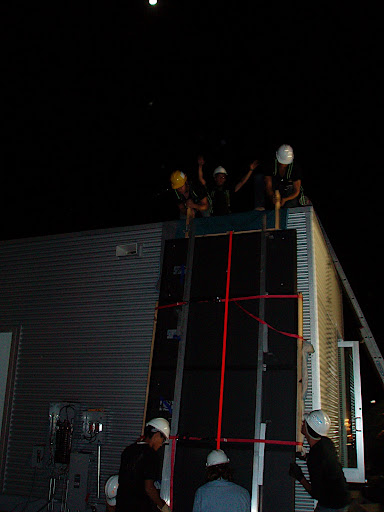 Raising the solar panels takes strength!  Even though we set up a special racking system just for raising the panels up on the roof, it still takes six guys to lift them into place.