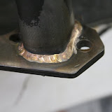 I had my engine builder, Bob Gromm, TIG the flanges on the outside with phosphor bronze. This makes them strong, and seals up the thin areas left by my grinding