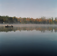 Time for a bit of Canadiana. This picture was taken early in the morning on Jack Lake, at a friends cottage. Daryl and Janet are in the canoe, while I am safely ensconced on the pier taking pictures. 
Location: Jack Lake 
Camera: Mamiya C330 Dual Lens
