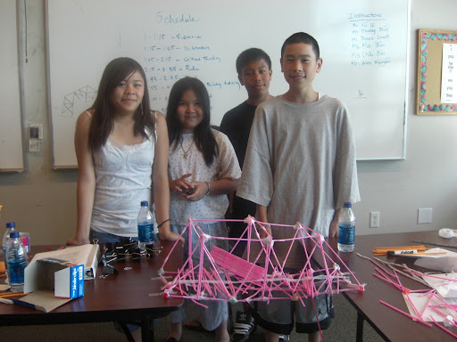 Students work in teams to build bridgets out of straw, learning about tension and compression along the way.