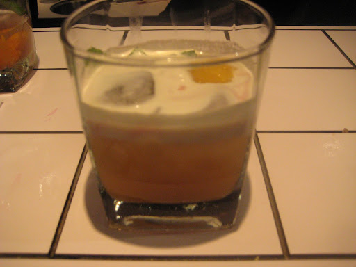 Dessert in a glass with the Pineapple Francis: fresh pineapple flamb?ed with aged rum and assam tea. Mixed with maraschino, orange liquor, green chartreuse and topped with creme Chantilly flavored with the botanical spirit, hum.