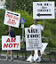 Two idiots - These must be the best signs I've ever seen.