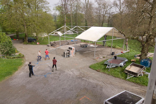 The set up crew setting up the dining tent