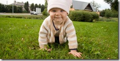 Baby girl in meadow
