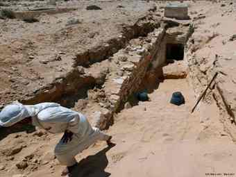 An Egyptian labor works at the entrance of an under restoration tomb at the ancient city of Leukaspis