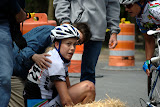 Rushlee Buchanan of Colavita/Baci Pro Cycling Team is tended to by teammates and spectators May 9, 2010, after crashing during the Sunday Criterium of the Joe Martin Stage Race in Fayetteville, Arkansas.