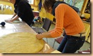 Trina bravely cutting into her project - a cushion cover.