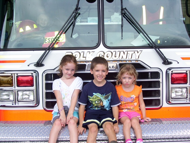 [my 3 kids in front of firetruck[3].jpg]