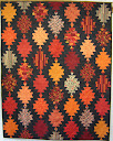“Lanterns of Light”  This is a quilt designed by Julie Wallace and features a quilt as you go technique. Skill Level : All
