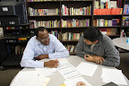 EPA Academy student, Gilberto Soria and Glow Board Member, Jim Cates review Gilberto's budget