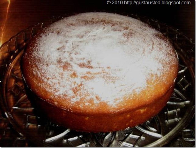 PASTEL DE QUESO Y NARANJA Espolvorea con azúcar glas