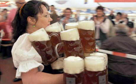 Beer Mug World Record...Anita Schwarz from Eichenau tries to set a new world record carrying 21 beer mugs at once across a distance of 40 metres in a tent near Zeltingen, Germany, 09 November 2008. However, Eichenau fails to transport the mugs in one piece. Ref: B284_123995_0002 Date: 09.11.2008 COMPULSORY CREDIT: UPPA/Photoshot
