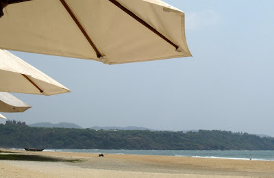 Umbrellas on the beach in Goa at the Leela Kempinski Hotel