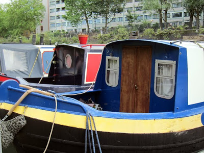 Three canal boats moored on Regent's Canal in London