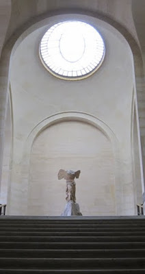 Winged Victory of Samothrace in an empty hall on a private guided Louvre tour in Paris