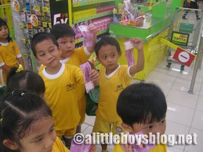 Kids go shopping Kids at the check-out counter