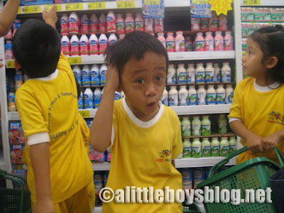 Kids go shopping Kids buying milk